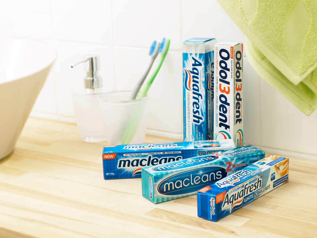 Tootpaste boxes with metalex film on a table