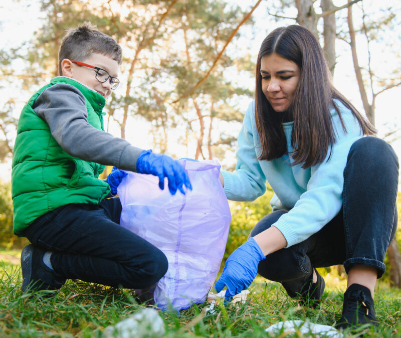 Mother and son collecting waste using Walki's mono-pe waste bags